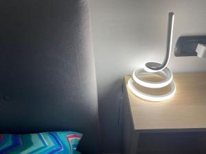 a bathroom with a toilet on a wooden table at Fazzoletto in Casalecchio di Reno