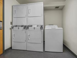 three white refrigerators and a refrigerator in a room at Expedition Station 313 Next To Slopes And Bike Trails WiFi Village in Snowshoe +4 photos