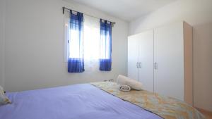 Postel nebo postele na pokoji v ubytování APARTAMENT LO COR DEL DELTA