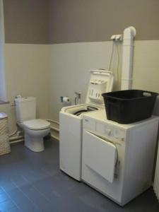 a bathroom with a toilet and a pot on a stove at Au Val Heureux, meublé 3 étoiles, Clévacances in Haybes +13 photos