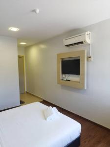 Postel nebo postele na pokoji v ubytování Santai Morib Hotel