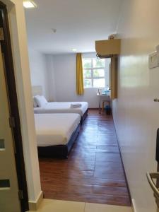 Postel nebo postele na pokoji v ubytování Santai Morib Hotel