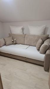 a brown couch sitting in a living room at Apartment Anton in Selce