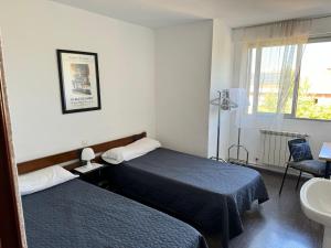 Katil atau katil-katil dalam bilik di Hostal El Pozarron