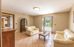 a living room with two couches and a table at 7 Bedroom Stunning Home In Caiazzo in Caiazzo