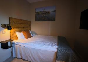 Postel nebo postele na pokoji v ubytování Åtellet Hotell
