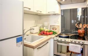 a kitchen with a counter with vegetables on it at Les 3 Oies in Sarlat-la-Canéda
