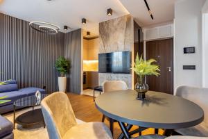 a living room with a table and chairs at The Residence 59 in Belgrade