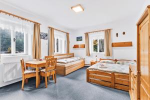 Postel nebo postele na pokoji v ubytování Pension Dita - Adršpach