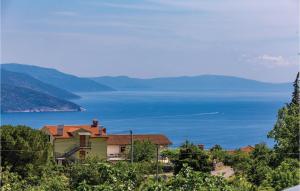a house on a hill with a view of the water at Nice Home In Brsec With House Sea View in Zagorje