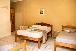Cama ou camas em um quarto em Pousada Portal mais 37 fotos