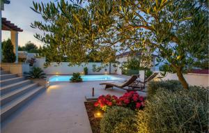 a patio with a tree and a pool at Villa Tatijana in Zadar +52 photos