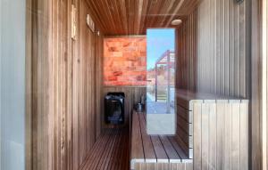 a bathroom with wood paneling and a glass wall at Villa Noeli in Hum