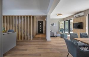 a living room with a table and chairs at Villa Primavera in Brtonigla