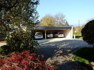 a garage with two cars parked in it at Ferienwohnung Silvia in Sankt Kanzian