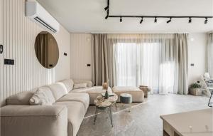 a living room with a couch and a table at Beautiful Home In Srima in Srima