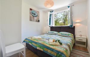 Postel nebo postele na pokoji v ubytování Two-Bedroom Holiday Home In Blato Na Cetini