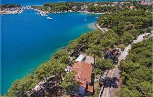 an aerial view of a lake with a house at Six-Bedroom Holiday Home In Sibenik in Šibenik +52 photos
