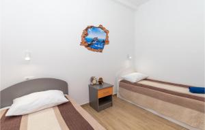Posteľ alebo postele v izbe v ubytovaní Two-Bedroom Holiday Home In Ploce