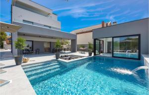 a swimming pool in the backyard of a house at Villa Opal in Zadar