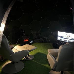 a room with two chairs and a computer monitor at Glamping Domes in Articlave
