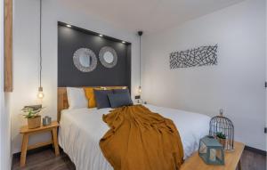 a bedroom with a bed with a blanket on it at Villa Arcus in Pakoštane
