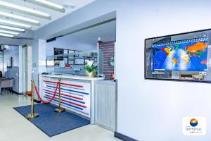 Televiisor ja/või meelelahutuskeskus majutusasutuses Hotel Terminus Maputo