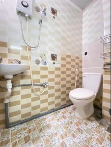 a bathroom with a toilet and a sink at Lavie House HCM - 2 Bedrooms House- Near Bui Vien street in Ho Chi Minh City