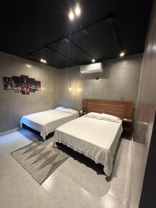a room with two beds in a room at El marqués casa boutique in Ríohacha +7 photos