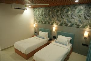 SKD RESORT AND CLUB客房内的一张或多张床位
