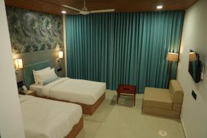 SKD RESORT AND CLUB客房内的一张或多张床位