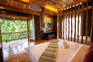 Postel nebo postele na pokoji v ubytování Andalay Beach Resort Koh Libong