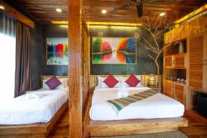 Postel nebo postele na pokoji v ubytování Andalay Beach Resort Koh Libong