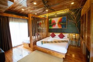 Postel nebo postele na pokoji v ubytování Andalay Beach Resort Koh Libong
