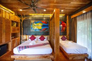 Postel nebo postele na pokoji v ubytování Andalay Beach Resort Koh Libong