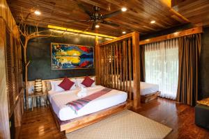 Postel nebo postele na pokoji v ubytování Andalay Beach Resort Koh Libong