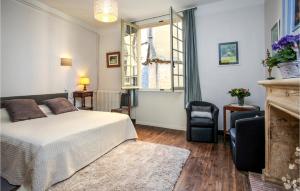 a bedroom with a bed and a window at St Marie in Sarlat-la-Canéda