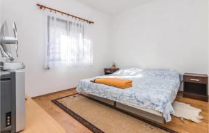 Posteľ alebo postele v izbe v ubytovaní Three-Bedroom Holiday Home In Sikovo + 9 fotografií