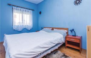 Postel nebo postele na pokoji v ubytování Three-Bedroom Holiday Home In Sikovo