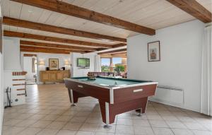 a large room with a pool table in it at Four-Bedroom Holiday Home In Romo in Tagholm