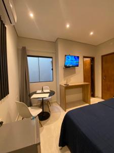 TV in/ali zabaviščno središče v nastanitvi Habitaciones con Baño