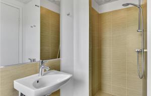 a bathroom with a sink and a shower at Studio Holiday Home In Skjern in Halby