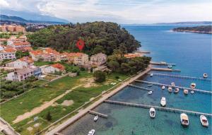 an aerial view of a small island with boats in the water at 1 Bedroom Cozy Apartment In Palit in Palit