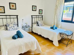 En eller flere senge i et værelse på Oasis Meloneras cerca del mar + 39 billeder