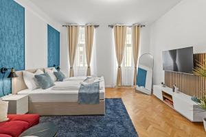 Televízia a/alebo spoločenská miestnosť v ubytovaní Zentrale, stilvolle und gemütliche Wohnung