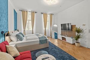 Televízia a/alebo spoločenská miestnosť v ubytovaní Zentrale, stilvolle und gemütliche Wohnung