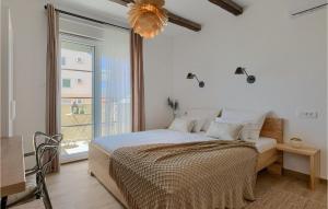 a bedroom with a bed and a large window at Villa Allegra Istriana in Pula