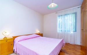 Postel nebo postele na pokoji v ubytování Apartment Zavalatica Iv