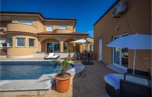 a villa with a swimming pool and a house at Awesome Apartment In Smrika With Wifi in Šmrika +25 photos