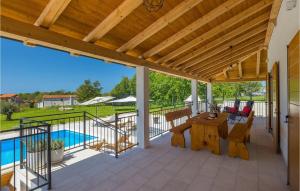 a patio with a table and chairs and a pool at Villa Roza-Dolinci in Sveti Petar u Šumi +44 photos